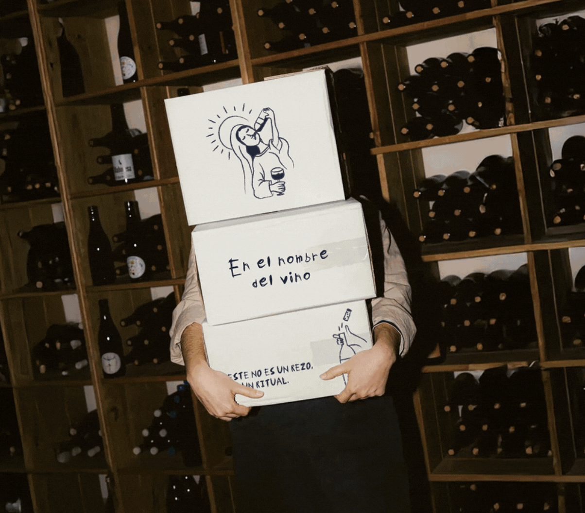 En el nombre del vino shipping boxes stacked in a wine cellar